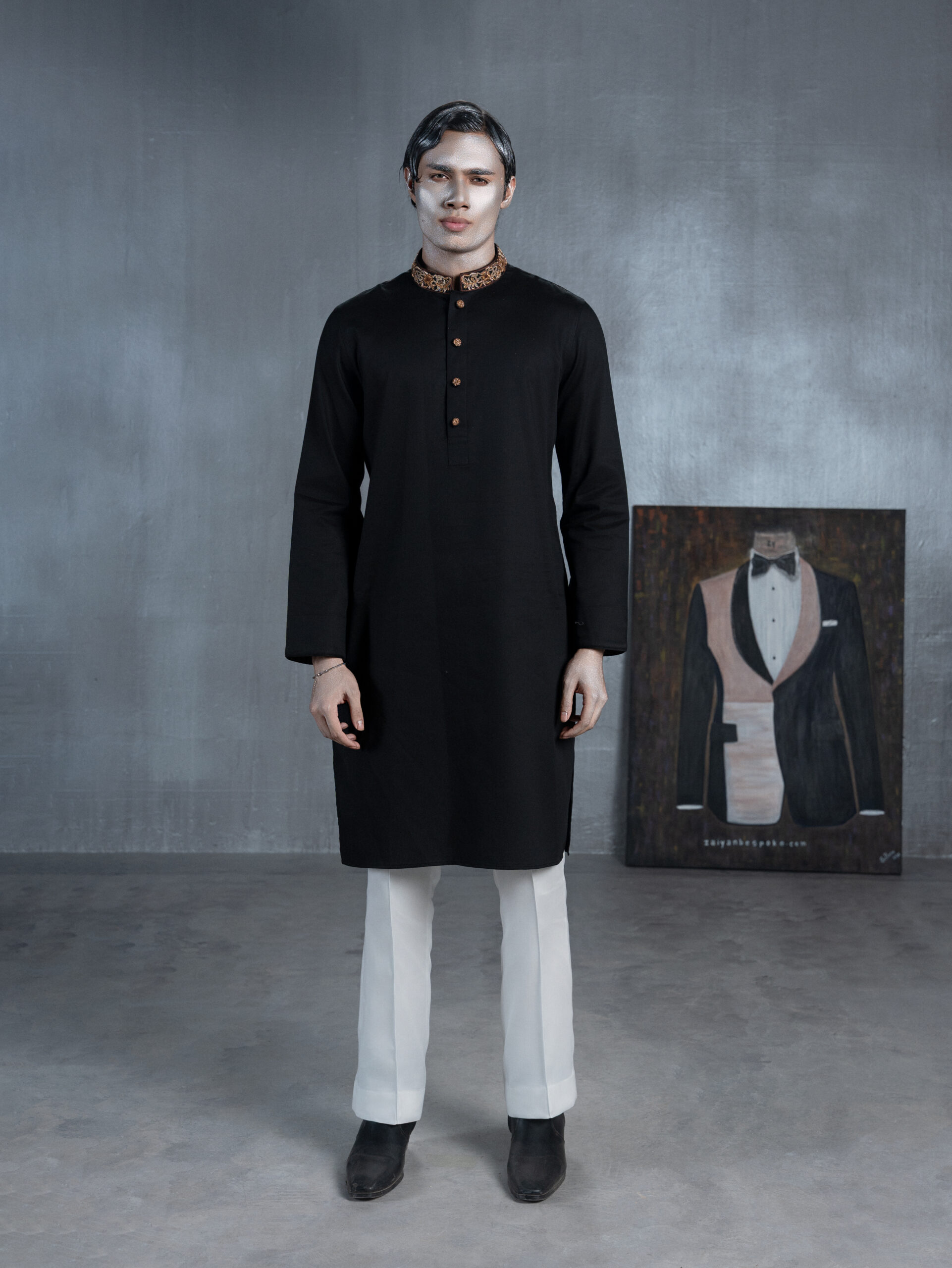 Black bespoke Panjabi with gold embroidered collar, decorative buttons and paisley-patterned cuffs