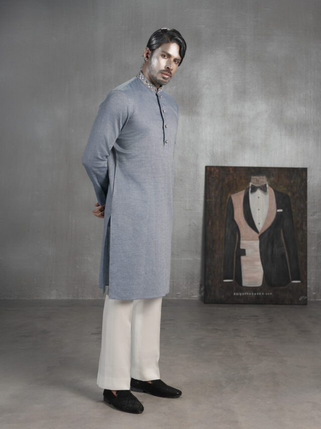 Grey blue bespoke Panjabi with embroidered collar and button detailing, paired with ivory trousers by ZaiYan Bespoke.