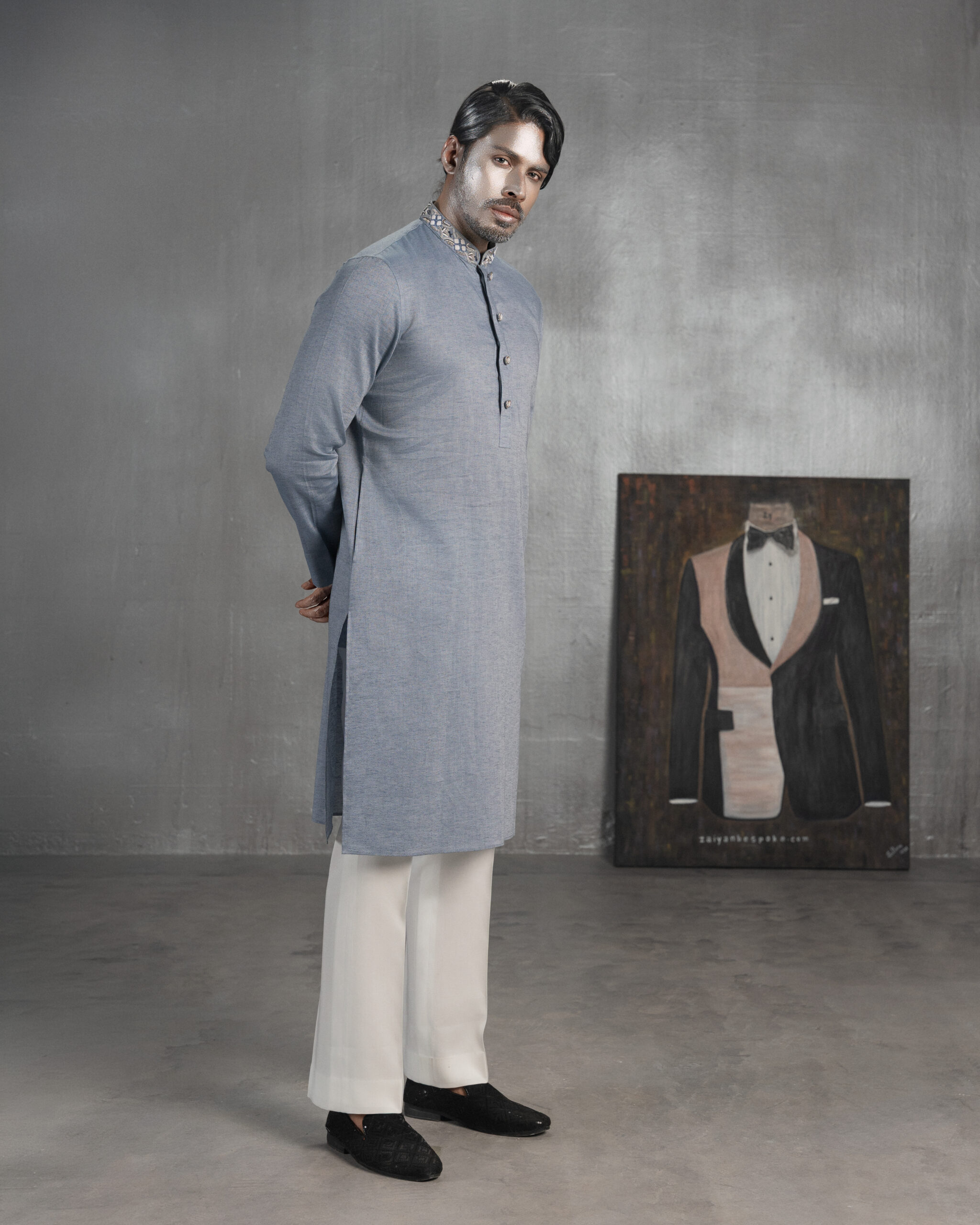 Grey blue bespoke Panjabi with embroidered collar and button detailing, paired with ivory trousers by ZaiYan Bespoke.