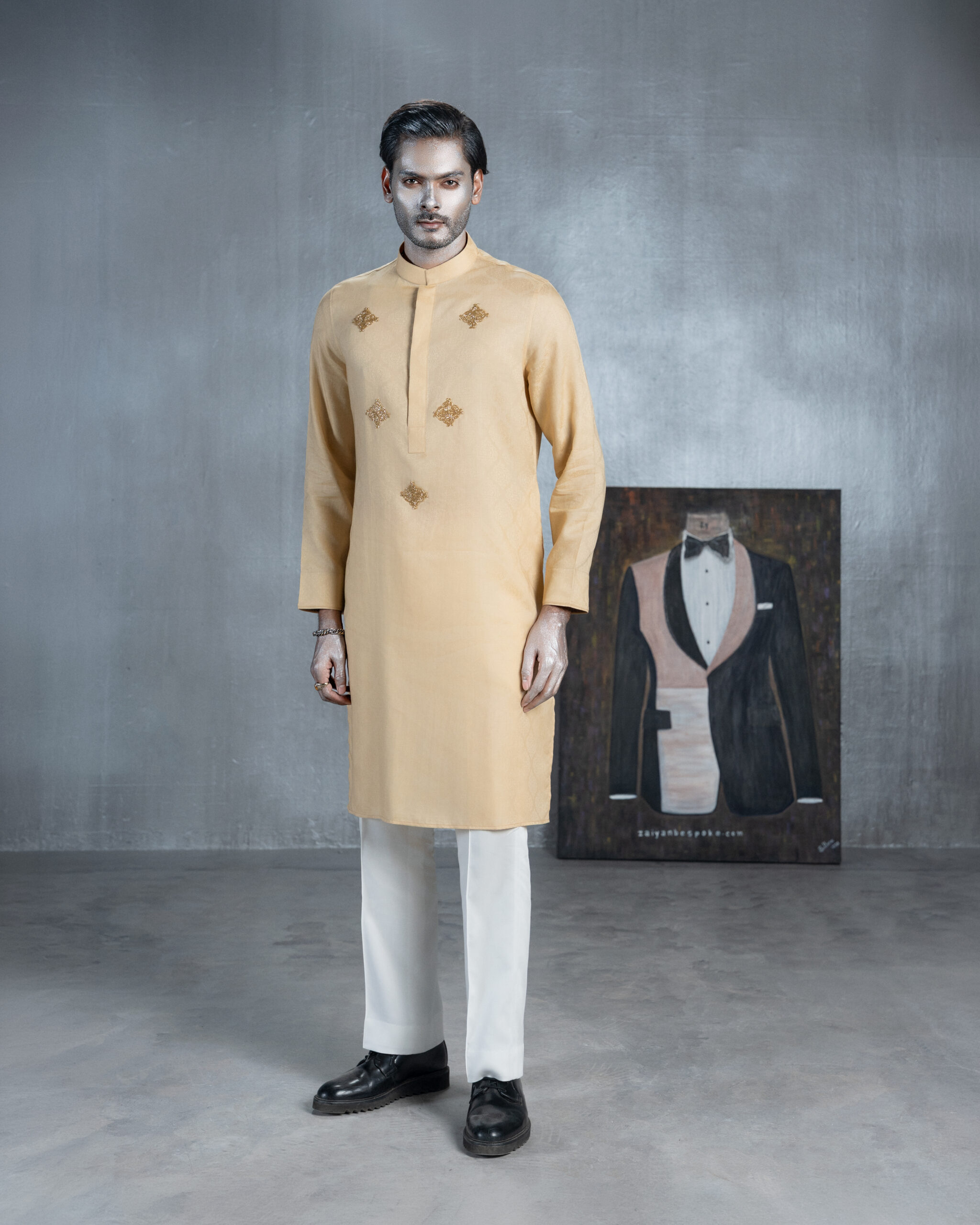 Golden beige bespoke Panjabi with gold embroidery and white trousers by ZaiYan Bespoke