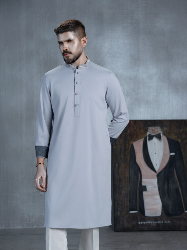 Men's ice blue bespoke Panjabi with silver embroidered band collar, decorative buttons and navy blue patterned cuffs